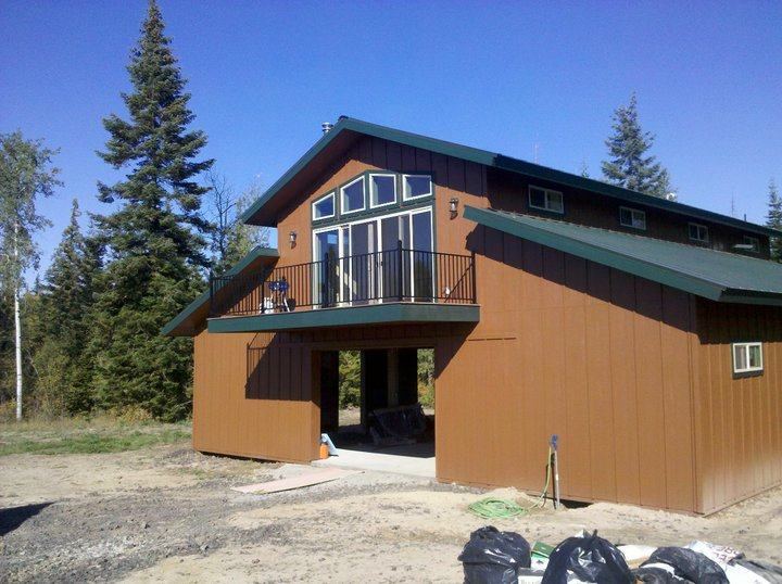 Custom pole building with full-height windows
