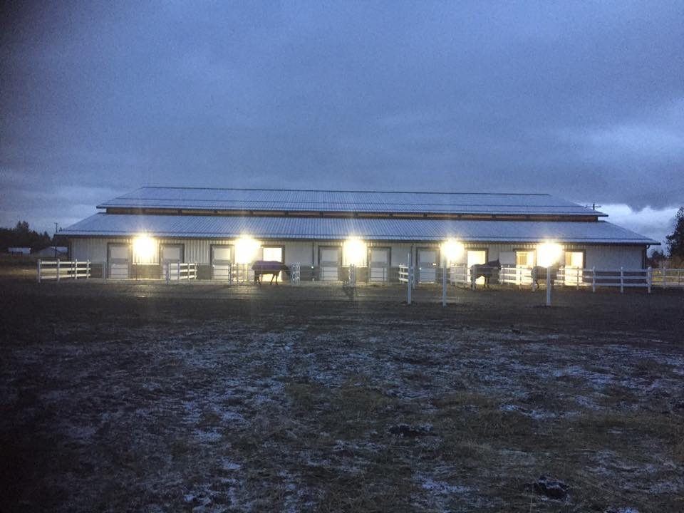 Post-frame riding arena in Hauser, Idaho