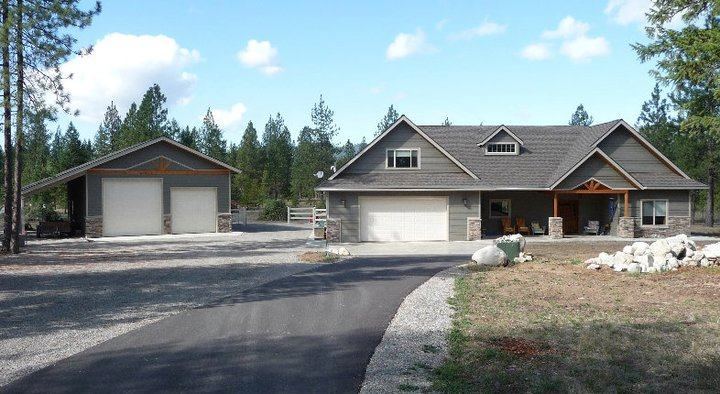 Custom garage and shop alongside a home